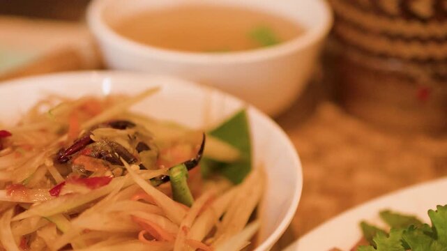 Traditional Thai Isan Cuisine with Papaya Salad and Larb