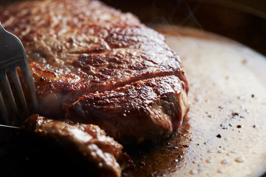 Beef steak in an iron pan