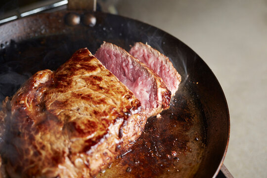 Beef steak in an iron pan