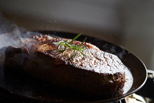 Beef steak in an iron pan