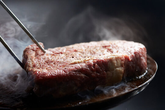 Beef steak in an iron pan