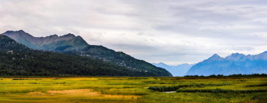 Alaska summer landscape at Potter Marsh Wildlife Refuge with view of Chugach Mountains and Rabbit Creek in Anchorage USA