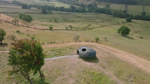 The Atom Panopticon, Wycoller, Pendle, Lancashire, UK. Slow Descent Shot Revealing Valley And Distant Hills As Cloud Shadows Move Over Valley.