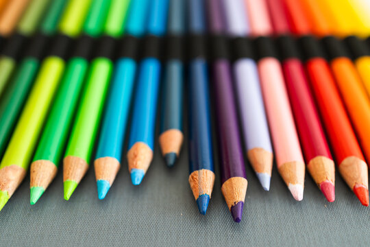 close-up of vintage colored pencils set neatly stored in pencil case, focus on the tips from 30 years old pencils