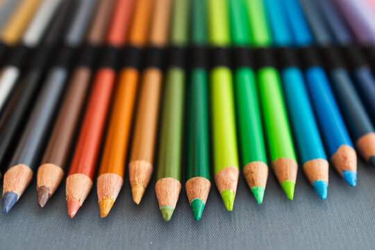 close-up of vintage colored pencils set neatly stored in pencil case, focus on the tips from 30 years old pencils