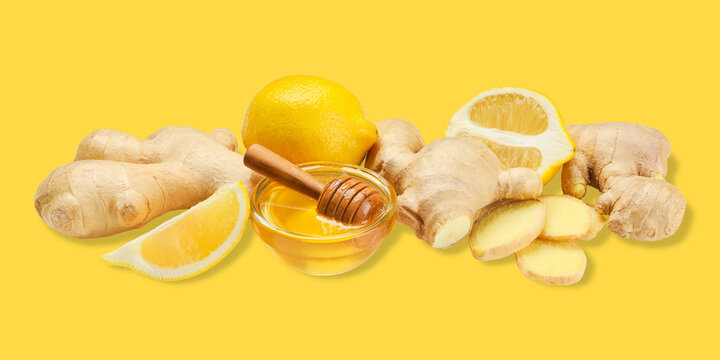 Ginger, lemon, and honey are beautifully arranged on a bright yellow backdrop