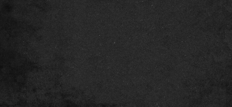 Black paper texture with fine fibers, subtle grain and matte appearance. Uniform dark background ideal for design, branding, presentations and elegant compositions.