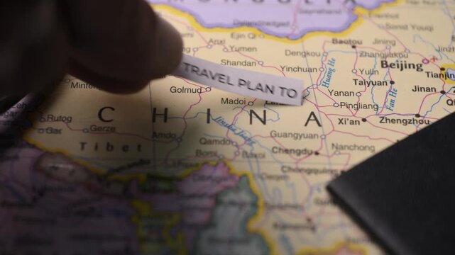 Travel Plan to China with Passport on World Map Tourism Vacation Planning Concept