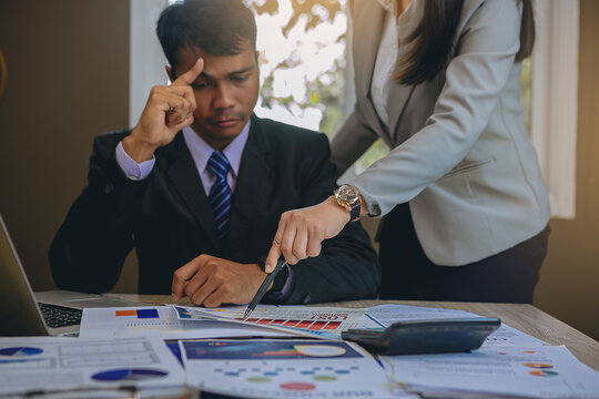 Talking about serious business. Business peoples meeting, discuss about business problem and bad business result. Selected focus