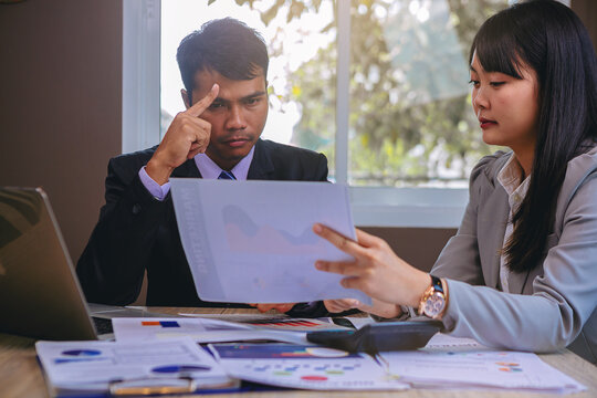 Talking about serious business. Business peoples meeting, discuss about business problem and bad business result. Selected focus