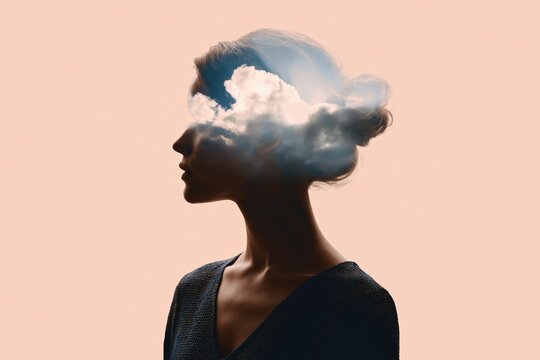 Surreal conceptual silhouette of a woman with clouds in her head for imagination