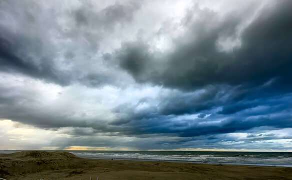 Nieuwpoort, West-Vlaanderen, Belgium, Ocotber 25th, 2025, dramatic storm clouds rolling over distant sea, heavy dark formations and restless sky signaling approaching weather with deep
