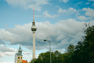 Berlin TV Tower and St. Mary's Church against cloudy sky, Germany © gadalab