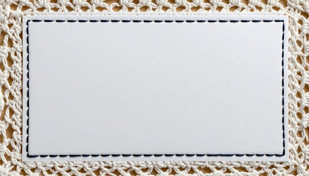 blank rectangular paper note stitched to white tatting lace border, intricate loop pattern, handmade textile and paper texture