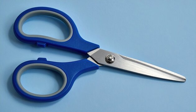 Professional blue-handled scissors with polished metal blades, office and craft supplies