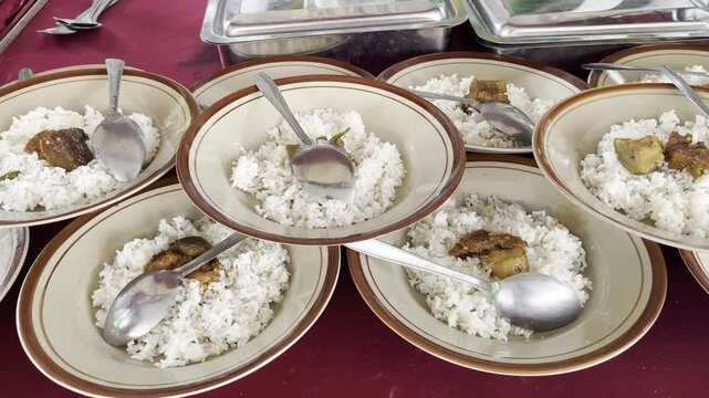 Traditional Indonesian mixed rice plates ready for catering service
