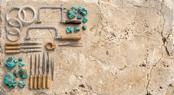  Top down view of Mediterranean jewelry tools on ancient limestone rock
