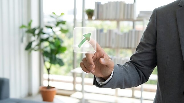 Businessperson pointing at green upward arrow green arrow
