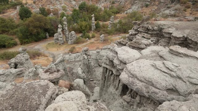 Natural stone town of Kuklica in northern Macedonia. Stone tables near the Kriva River