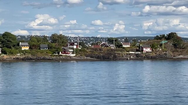 Island summer cabins in Oslo fjord, Norway. These small scenic cabins on the islands in the fjord are popular vacation spots for the local city population.