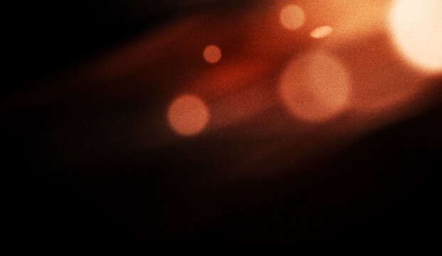 Orange Light Leak Overlay with Glowing Bokeh, Warm Film Burn, Lens Flare and Grainy Vintage Cinematic Effect on Black