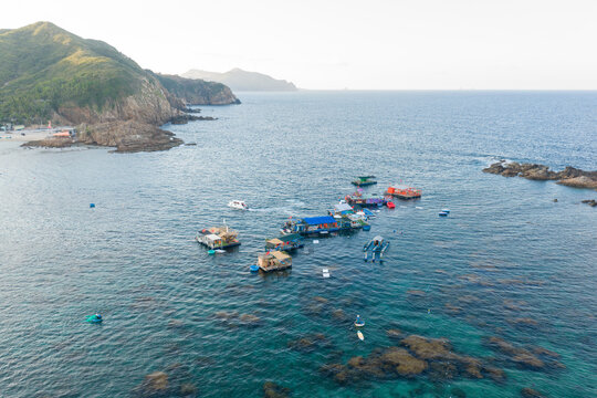 Panoramic aerial view of Nhon Hai fishing village, beach, and sparkling sea in Binh Dinh province, Vietnam