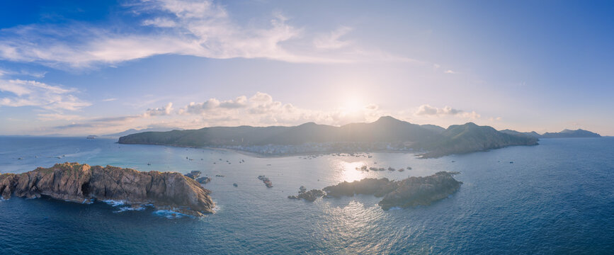 Panoramic aerial view of Nhon Hai fishing village, beach, and sparkling sea in Binh Dinh province, Vietnam