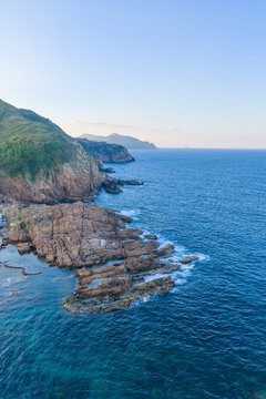 Panoramic aerial view of Nhon Hai fishing village, beach, and sparkling sea in Binh Dinh province, Vietnam