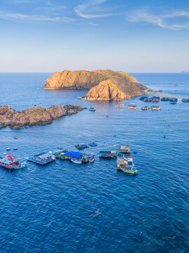 Panoramic aerial view of Nhon Hai fishing village, beach, and sparkling sea in Binh Dinh province, Vietnam