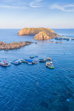 Panoramic aerial view of Nhon Hai fishing village, beach, and sparkling sea in Binh Dinh province, Vietnam