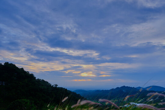 green mountain valley under moody cloudy sky