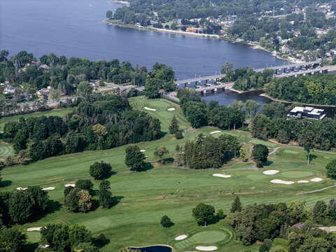 Aerial view of lush golf course near Laval Quebec Canada with ponds, trees and fairways. g.