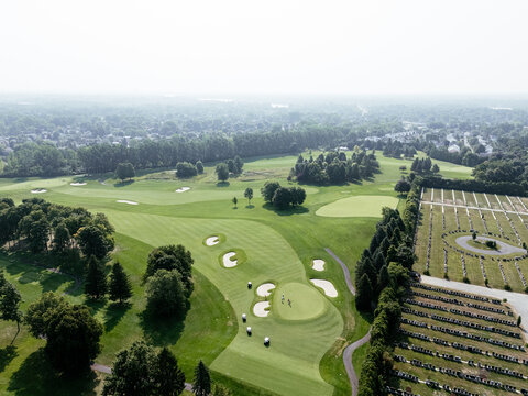 Aerial view of lush golf course near Laval Quebec Canada with ponds, trees and fairways. g.