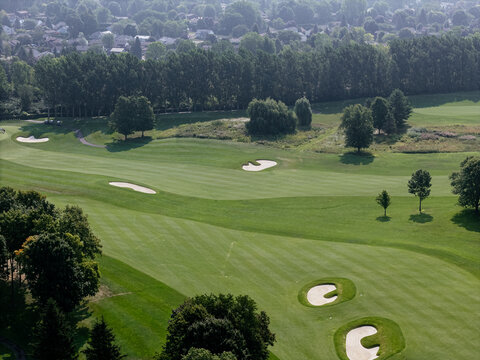 Aerial view of lush golf course near Laval Quebec Canada with ponds, trees and fairways. g.