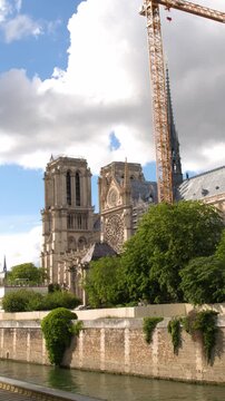 Notre Dame Cathedral Renovation with Construction Cranes and Seine River