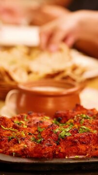 Sizzling Chicken Tikka Tandoori Platter in an Indian Restaurant