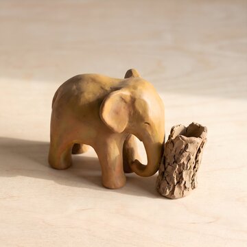 Handcrafted clay elephant figurine, ceramic animal sculpture, rustic home decor