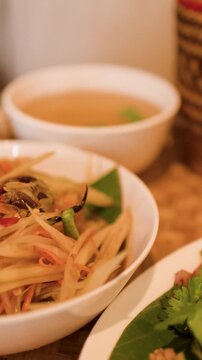 Traditional Thai Isan Cuisine with Papaya Salad and Larb