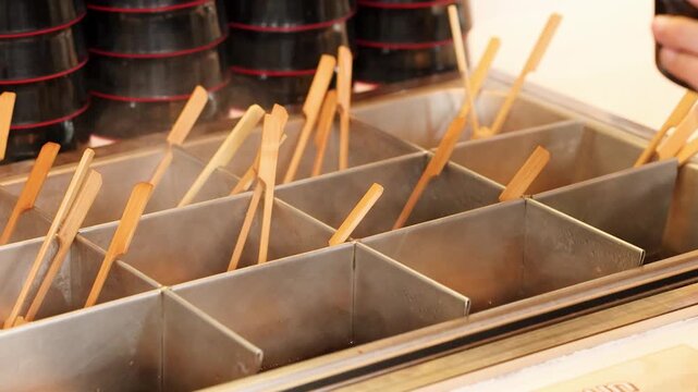 Korean Fish Cake Skewers in Hot Broth at Street Food Stall