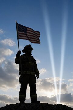 Brave firefighter stands tall, holding American flag against striking beams of light