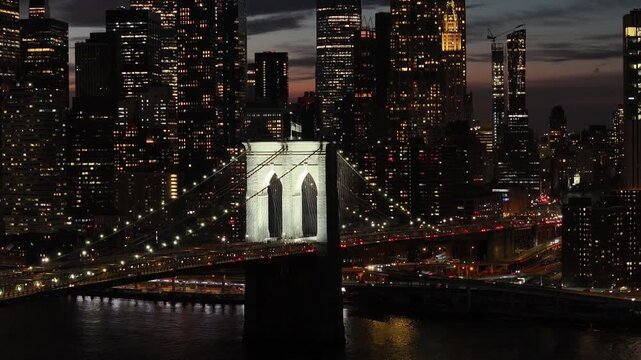 Night Scape Of Brooklyn Bridge At Manhattan In New York United States. City At Night Scene. Illuminated Bridge Landscape. Brooklyn Bridge At New York United States. Highrise Buildings.