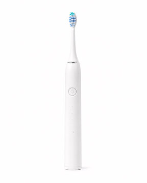Modern white electric toothbrush on isolated background