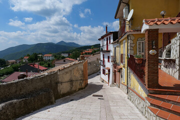 Obraz premium A narrow street among the old houses of San Gregorio Matese, a village in Campania, Italy.
