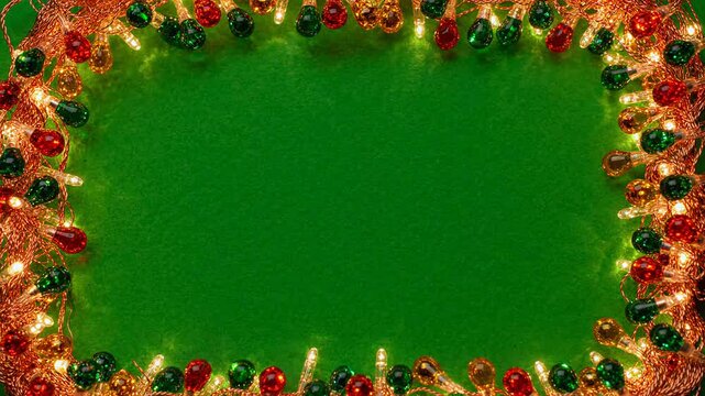 Festive Christmas frame border made of glowing red and green LED lights on a textured green background for holiday greeting card template or seasonal product promotion