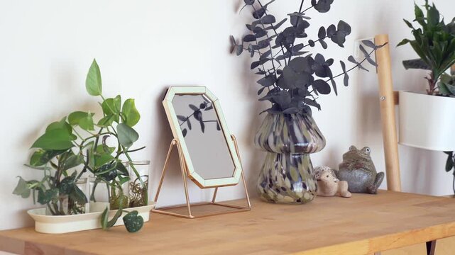 Decorating a table with plants and a mirror