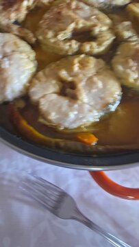 preparation and cooking of hake in a casserole dish, gastronomy