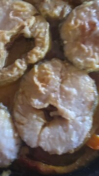 preparation and cooking of hake in a casserole dish, gastronomy