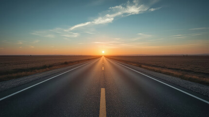 Naklejka premium Endless road toward glowing horizon beneath clear sunset sky