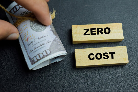 Concept of zero cost text on wooden blocks.