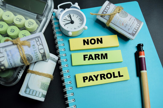 Concept of non farm payroll write on sticky notes isolated on table.